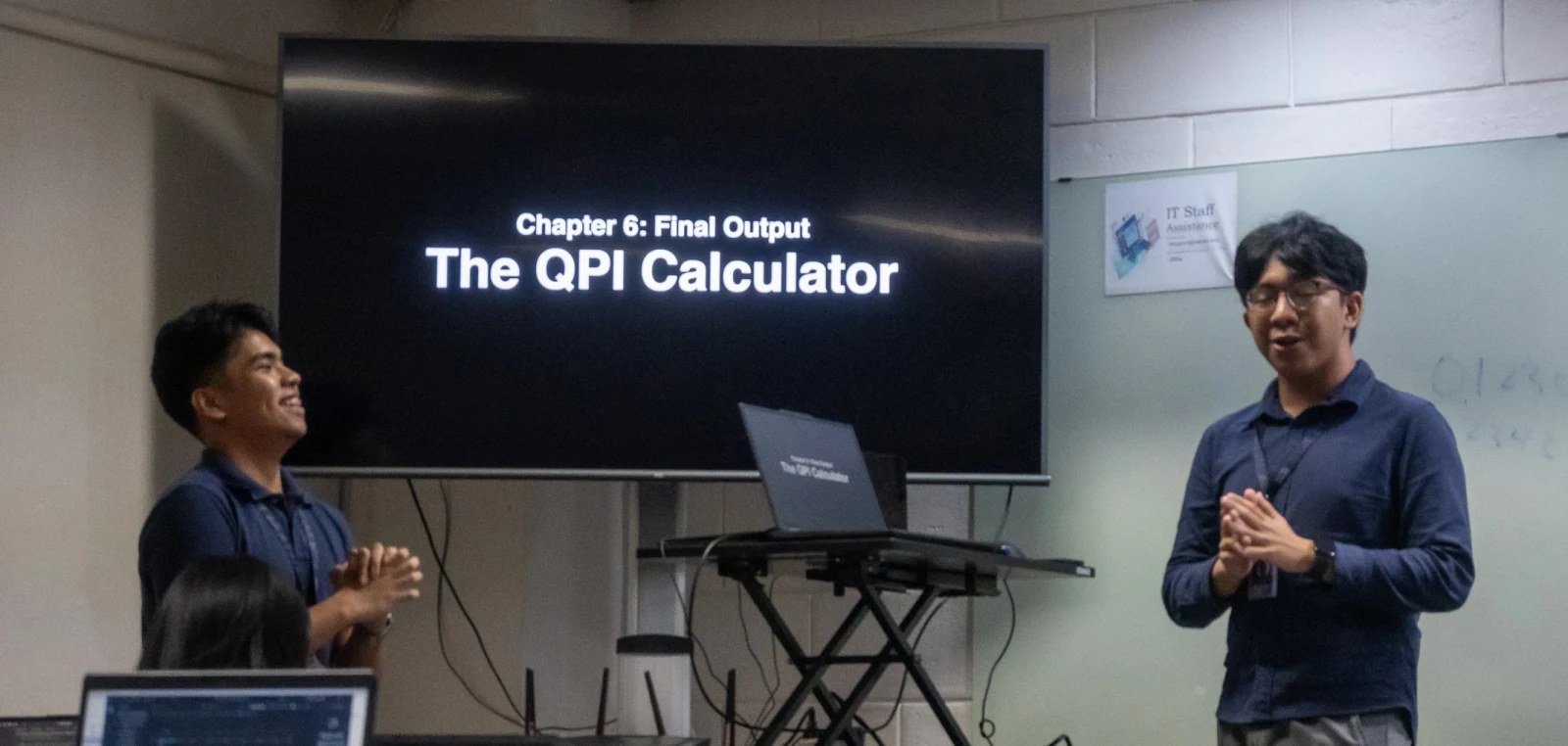 A Python workshop slide showing the QPI Calculator final output.